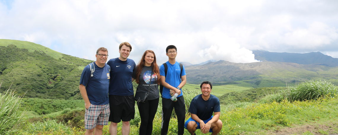 Professor Crawford and students visit the island of Kyushu's Mount Aso. This volcano erupted while they were there;  smoke pours from the crater.