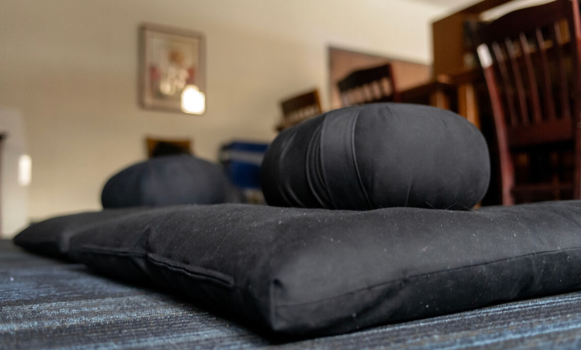 Meditation cushions, also known as "zafus," create a comfortable space for students.