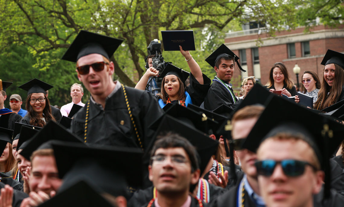 The ceremony grows raucous as friends cheer each other on during the diploma ceremony.