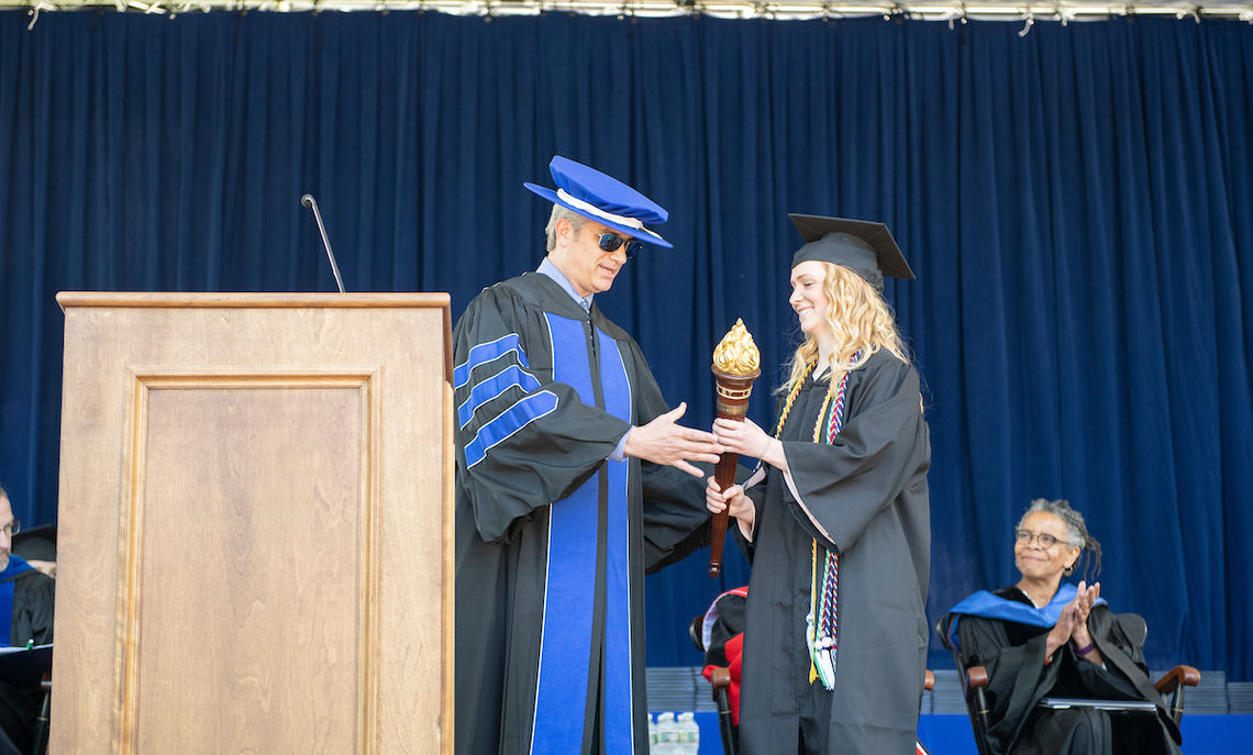 Jack Shilling, board president of F&M's Alumni Association, passes the torch to the next generation of alumni, represented by Jacqueline Koob '19.