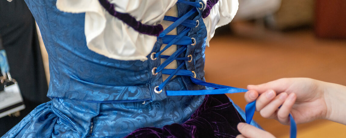Rachel Sheffield '20, lead interpreter and historic clothing coordinator at First State Heritage Park in Dover, Del., presented her designs to students in Brooks College House.