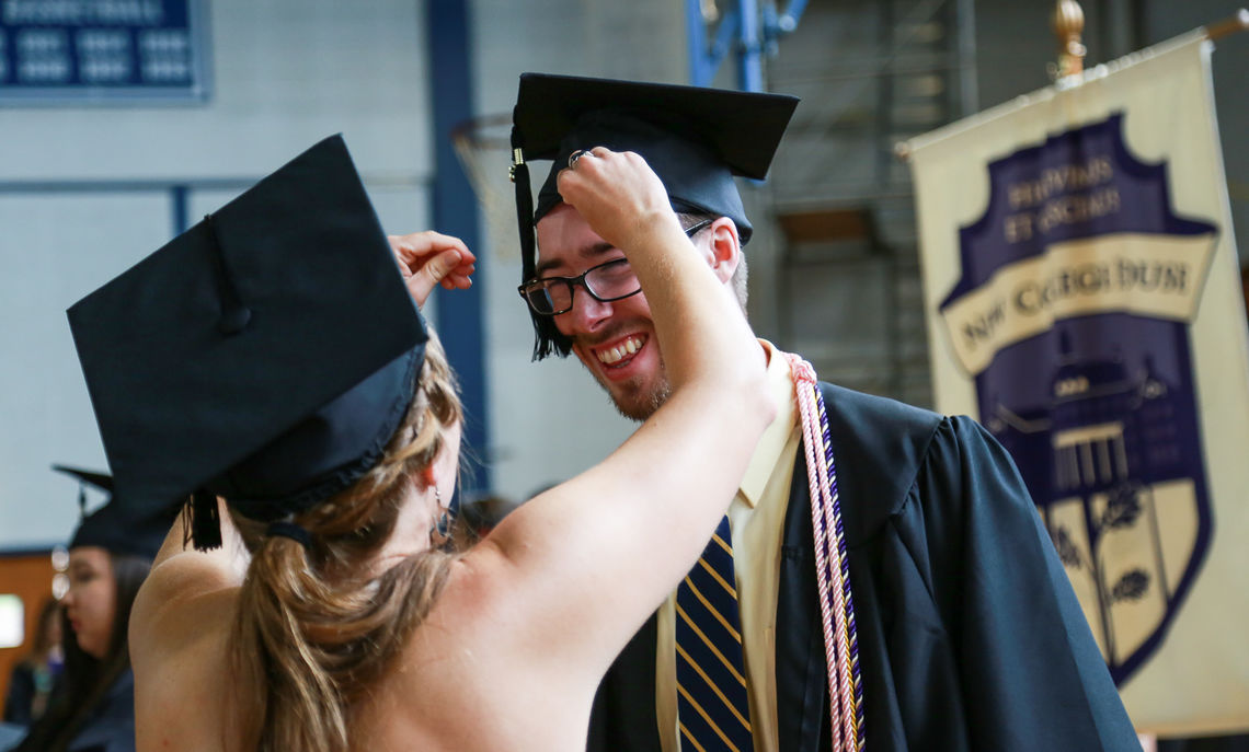 Soon-to-be-graduates make last-minute fixes before they prepare to process onto Hartman Green.