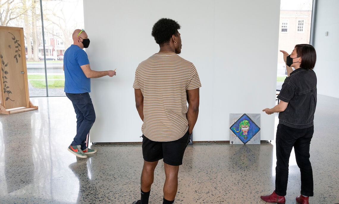 … to prepare his pieces, “X-perience,” for exhibition. Says Lee: “Learning how to present mounting and installing their Capstone works for public exhibition provides them with skills and a platform to discuss their work with wider audiences.”