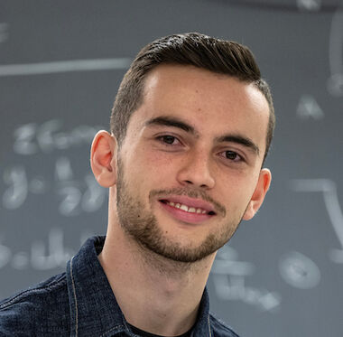 Menelaos Raptis '26 shown in Hackman Physical Sciences Laboratories.