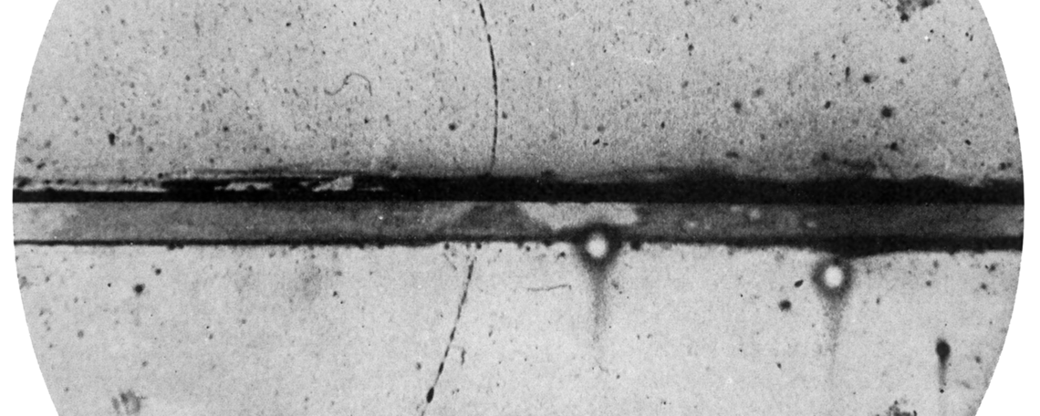 Cloud chamber photograph of a positron passing through a lead plate, taken in 1932 by Carl D. Anderson