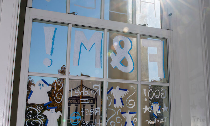 Blue and white decor adorned the window of campus buildings.
