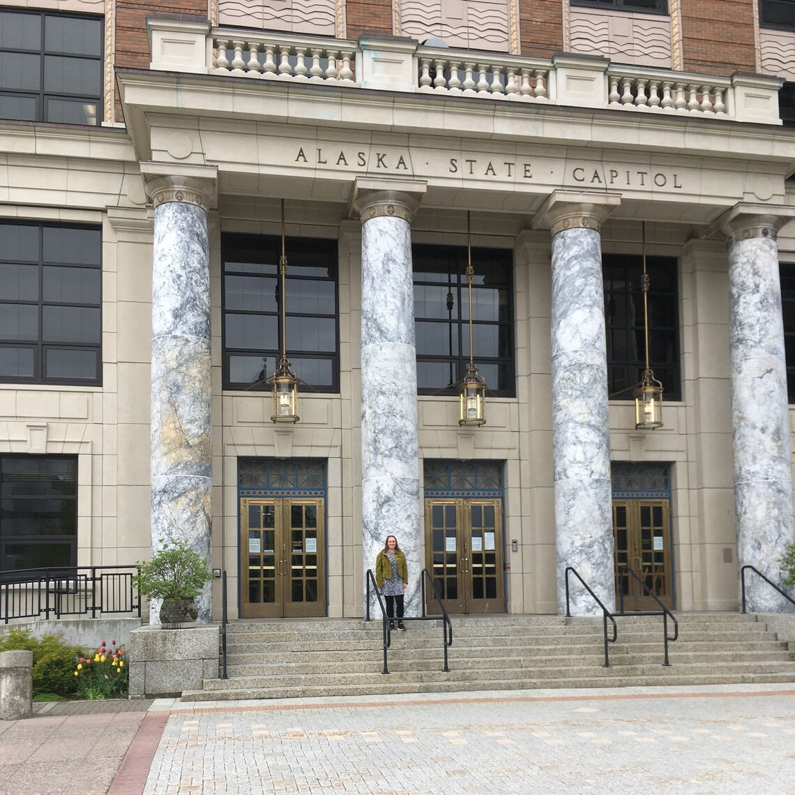 Ashley Guernsey '22 in front of the Alaska state capitol building in Juneau.