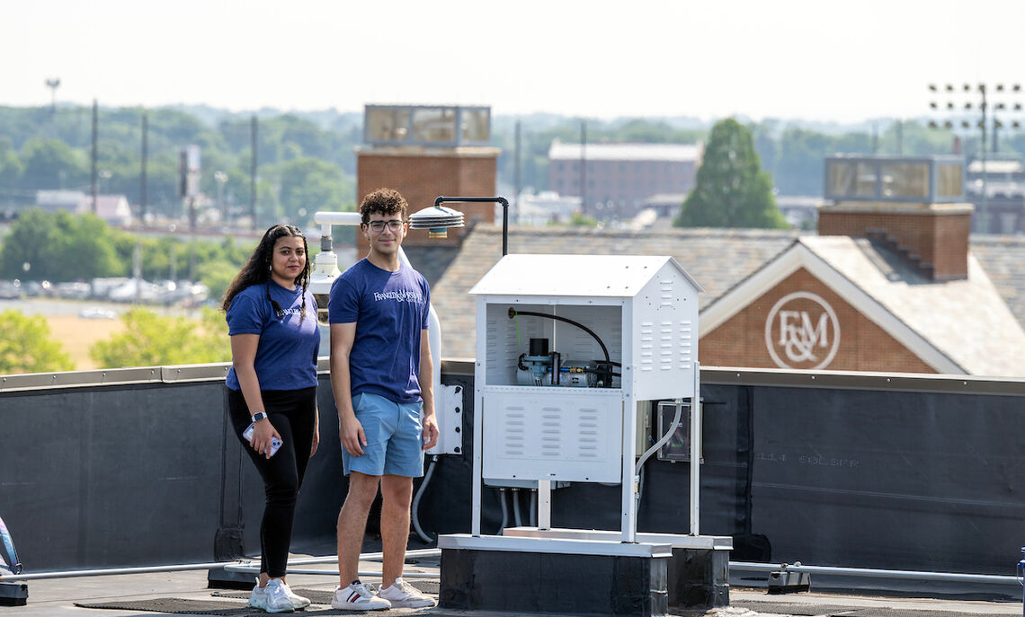 The summer researchers and the variable speed air sampler unit that was donated to the college  a couple of years ago to initially monitor natural radionuclides.