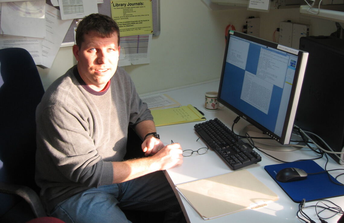 Professor of Astronomy Fronefield Crawford in his office.