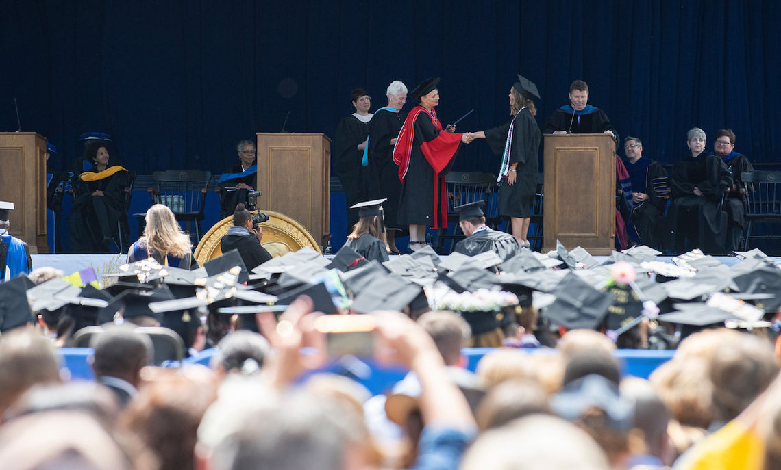 Graduates assembled via their College Houses to receive their diplomas.