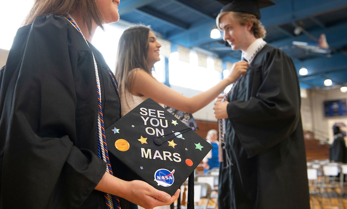 Robing in Mayser Gym where a few caps signal the future of the wearer.