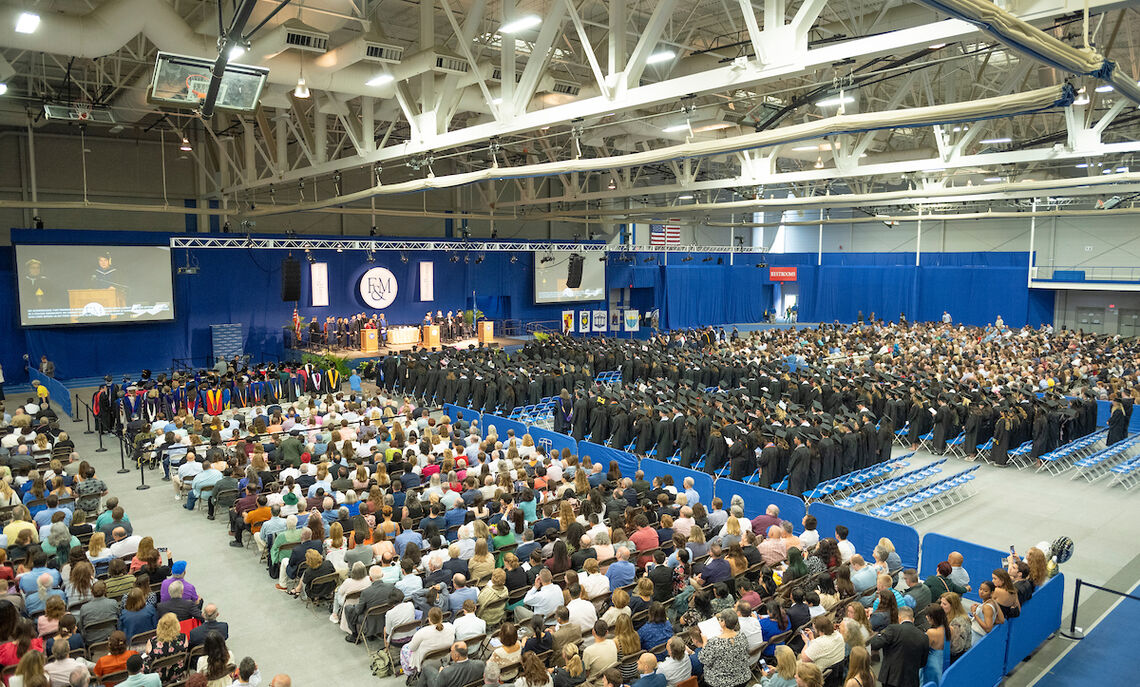 Class of 2023 grads gather in the Alumni Sports & Fitness Center.