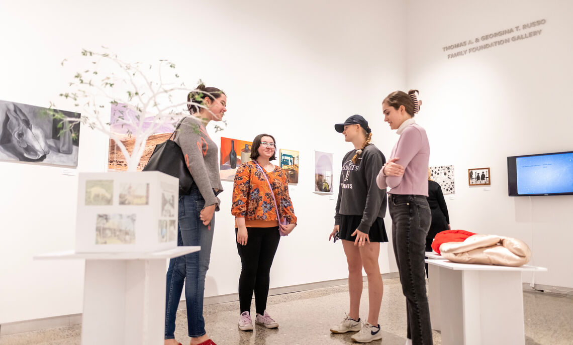 Students gather at the Susan and Benjamin Winter Visual Arts Center to celebrate a monthlong exhibition of student artwork displayed during the Winter72 Student Art Show.