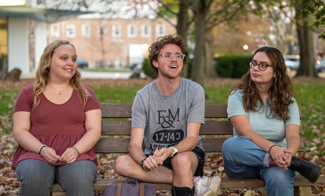 Caroline Kleis '24, Bennett Wasch '23, and Athena Kotsopriftis '25, pictured at Buchanan Park, discuss their involvement with Lancaster Composting Co-Ops.