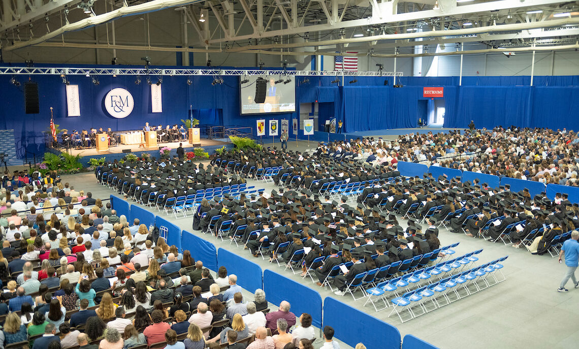 Class of 2023 grads gather in the Alumni Sports & Fitness Center.