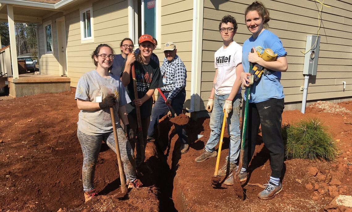 Digging trenches for water lines.