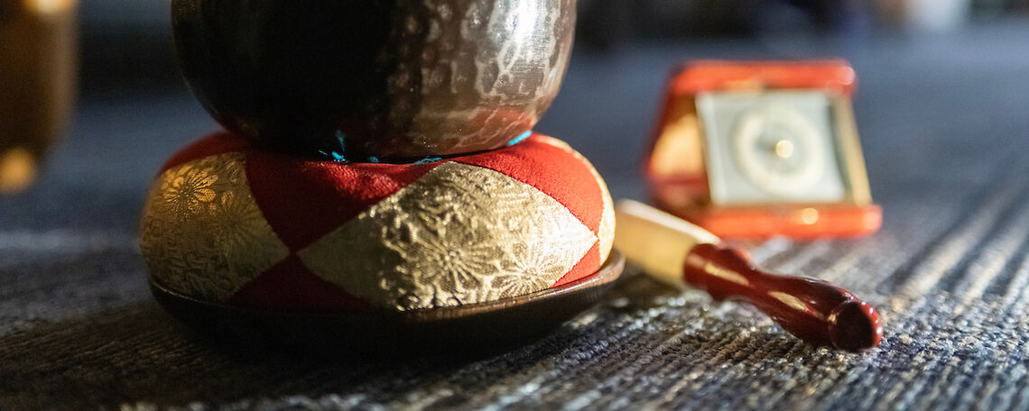 A bronze singing bowl, struck by a mallet, is often used in spiritual settings to invoke meditation through resounding vibrations.