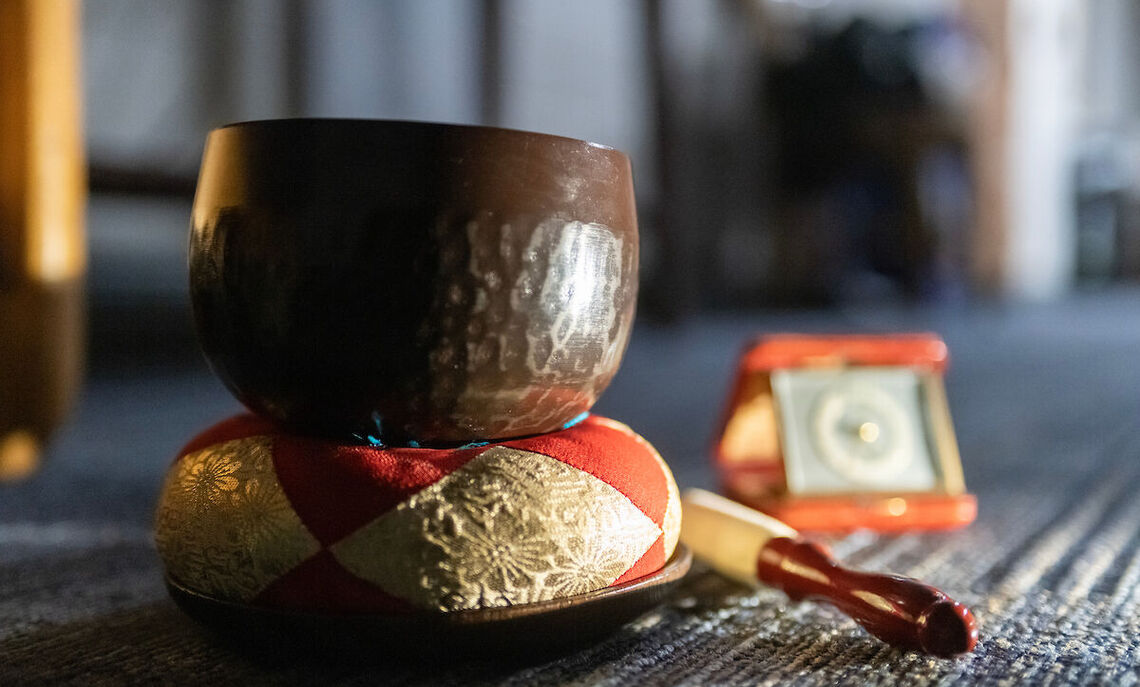 A bronze singing bowl, struck by a mallet, is often used in spiritual settings to invoke meditation through resounding vibrations.