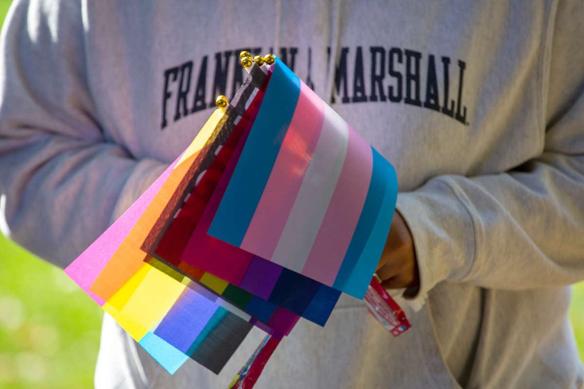 F&M student holding LGBTQ+ flags F&M student holding LGBTQ+ flags