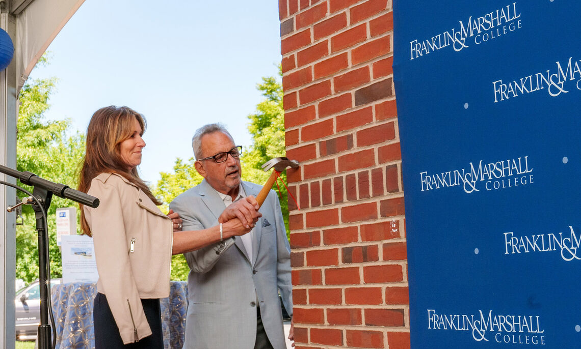 f m... The celebration of the Lombardo Welcome Center featured traditional elements from Chinese feng shui principles. Using a ceremonial hammer, Sam and Dena Lombardo tapped on the southwest corner of the building, invoking good luck for the construction project.