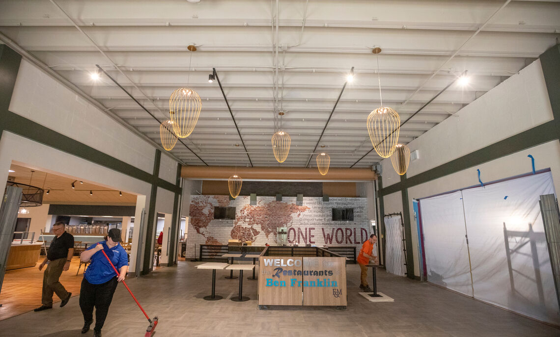 08 12... A team sweeps the space in anticipation of moving in the new furniture.