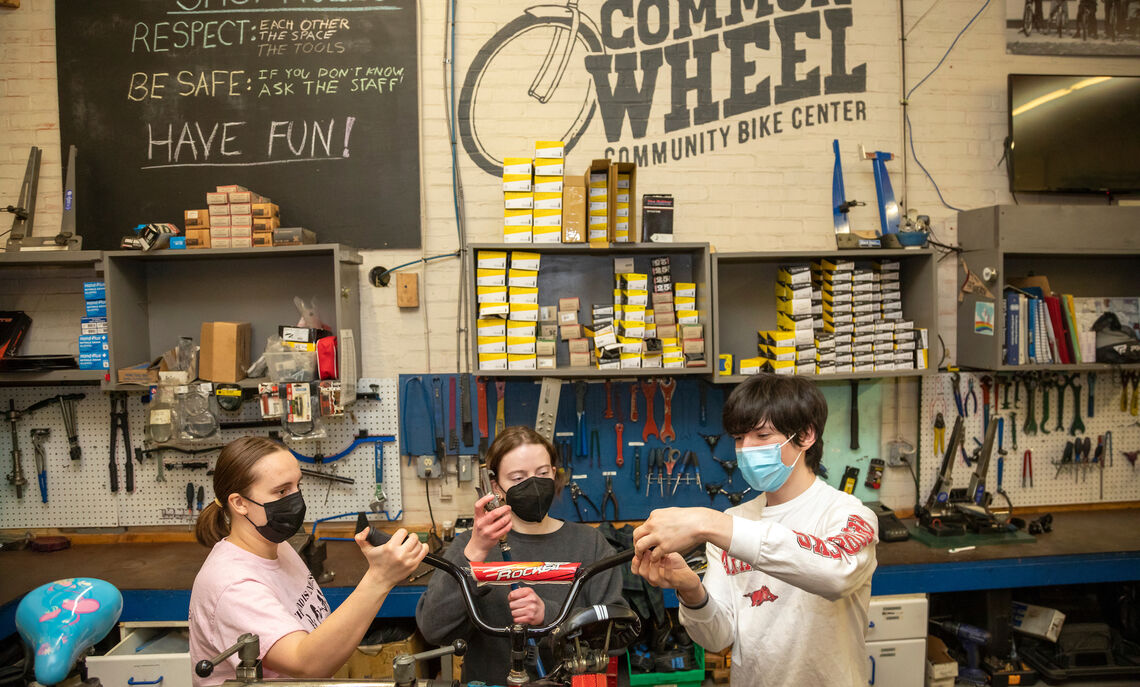 03 02... Students volunteer at The Common Wheel on Wednesday evenings during the spring semester. Each year, the nonprofit collects and refurbishes bikes to donate to Lancaster youth.