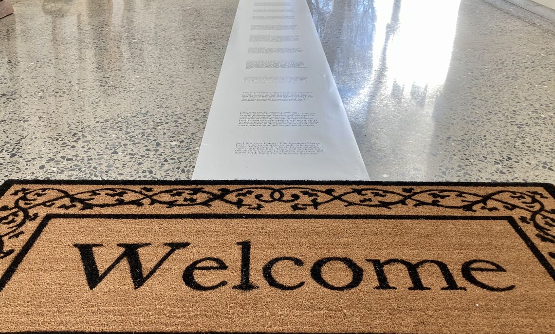 ... The welcome mat is one of the elements to reflect a migrant's journey.